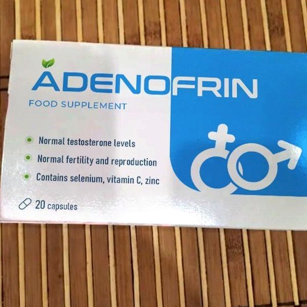 Caja blanca y azul de Adenofrin, 20 cápsulas, con los símbolos masculino y femenino, sobre esterilla de bambú