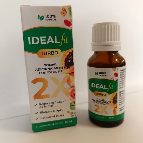 Caja de IdealFit Turbo con el 2X dorado junto a su frasco cuentagotas ámbar, sobre una mesa