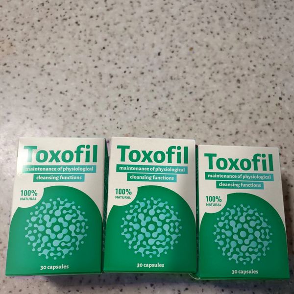 Tres cajas de Toxofil en fila
