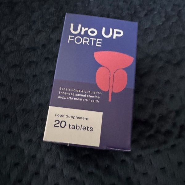 Caja azul de Uro UP Forte de 20 comprimidos sobre una manta oscura