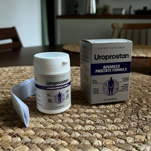 Bote y caja de Uroprostan sobre un salvamanteles de mimbre